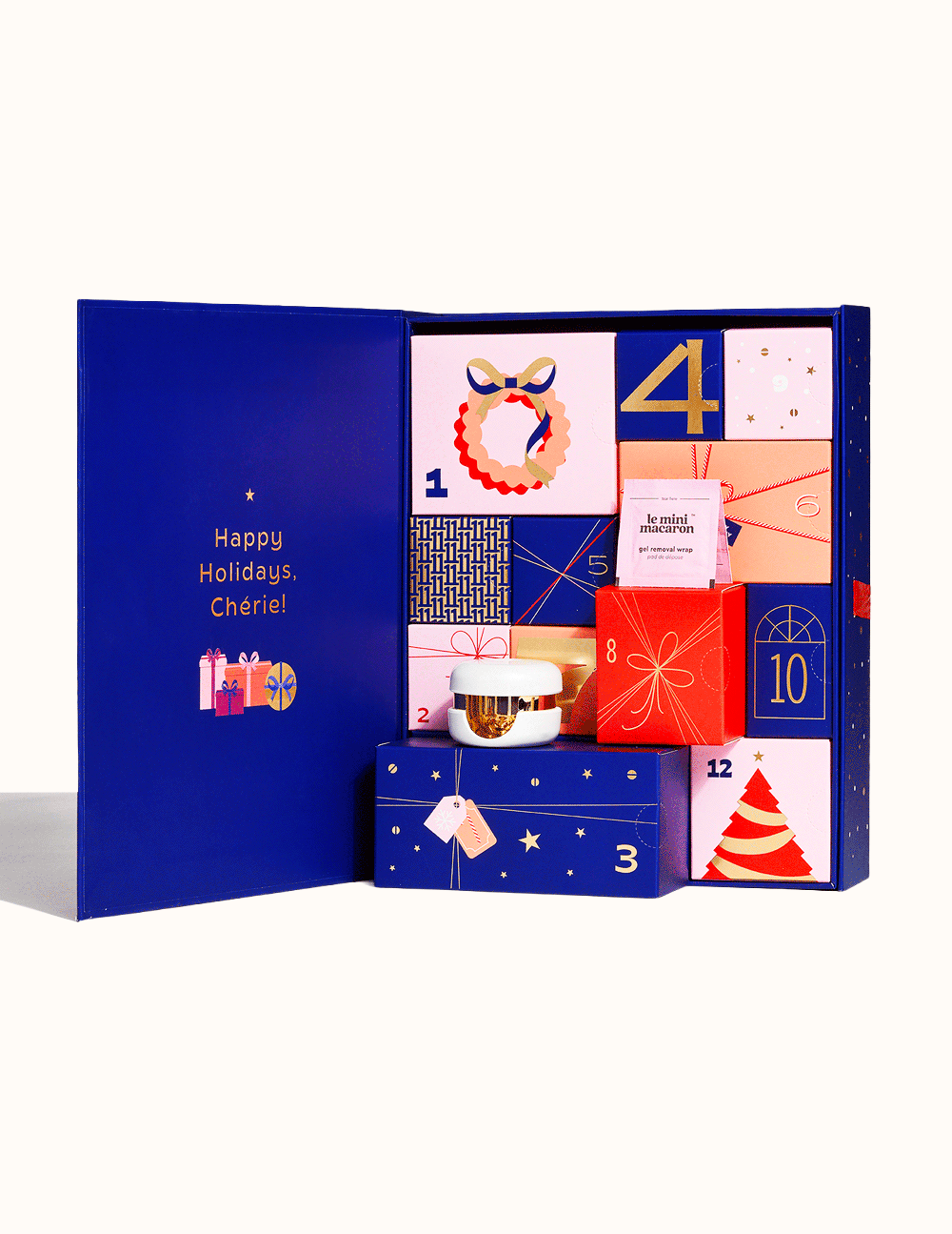Animated GIF of the Le Mini Macaron 12 Days of Nails Advent Calendar showing individual numbered gift boxes sliding out with nail products resting on top.