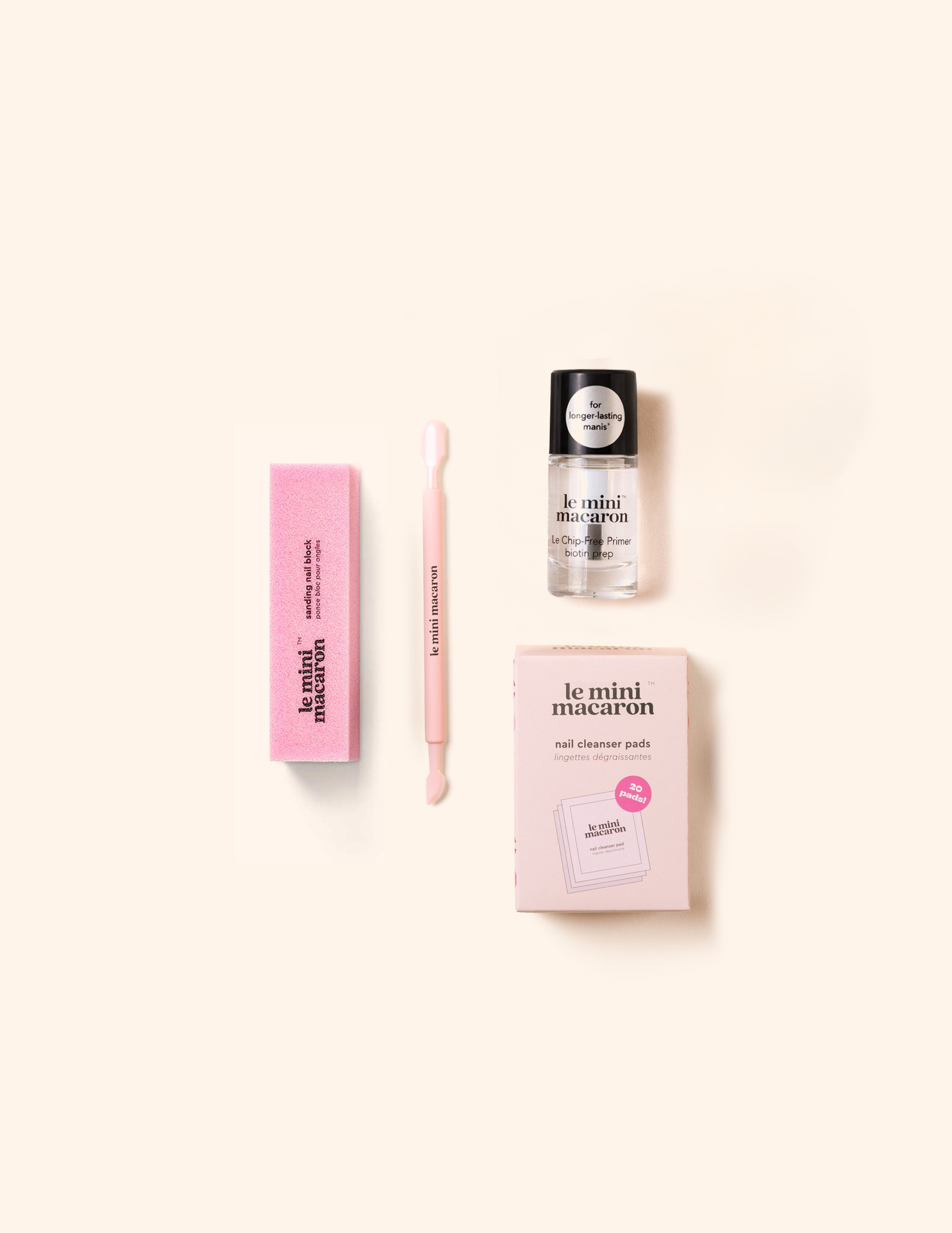 Le Mini Macaron Basic Prep Bundle featuring a cuticle pusher, sanding block, nail cleanser prep pads, and Le Chip-Free Primer.