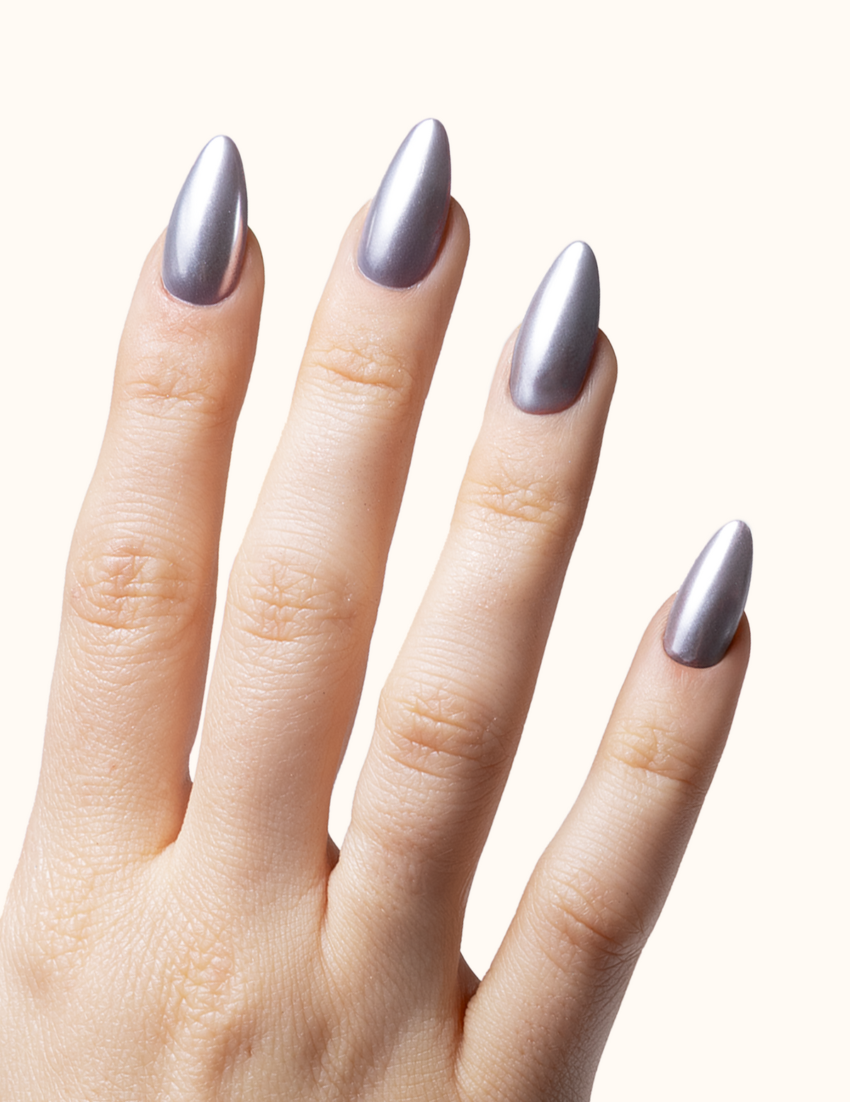 Close-up of hands featuring an icy metallic silver chrome manicure with a mirror reflection finish.
