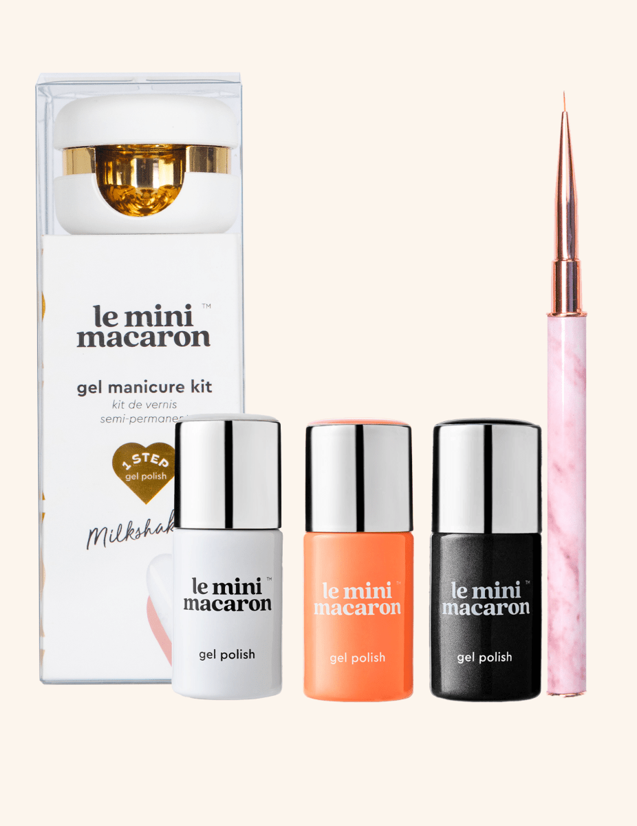 Le Mini Macaron Happy Halloween Bundle featuring the Milkshake Gel Manicure Kit, Mango and Magie Noire polishes, and Le Petit Brush.
